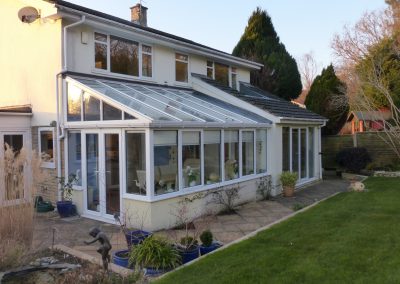 Tiled extension with glazed conservatory